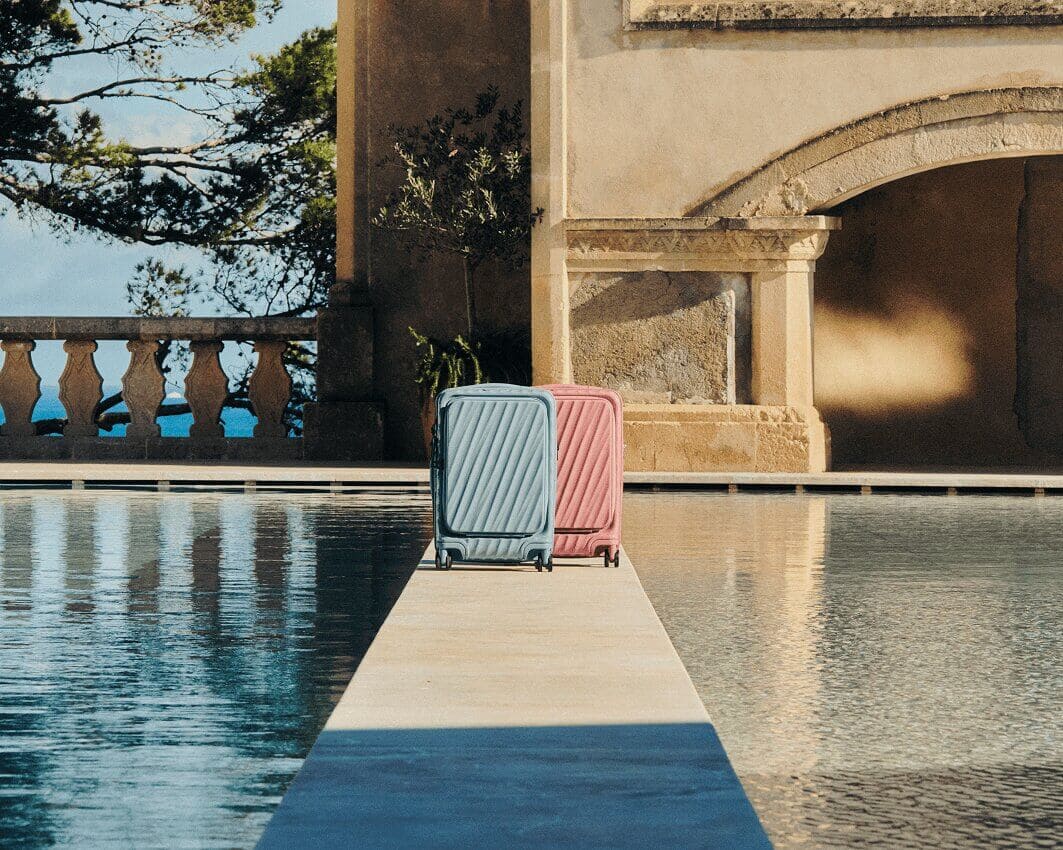 Suitcases near a poolside walkway